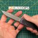 holding the blade of the Guardian Tactical Scout knife