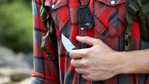 man holding the CRKT Minimalist Bowie