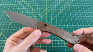 holding the Civivi Elementum Button Lock Knife