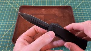 Holding the Microtech Hera