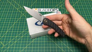 holding the ZT 0545 knife