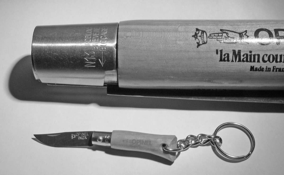 The closed No. 13 beside a tiny No. 2 keychain Opinel.
