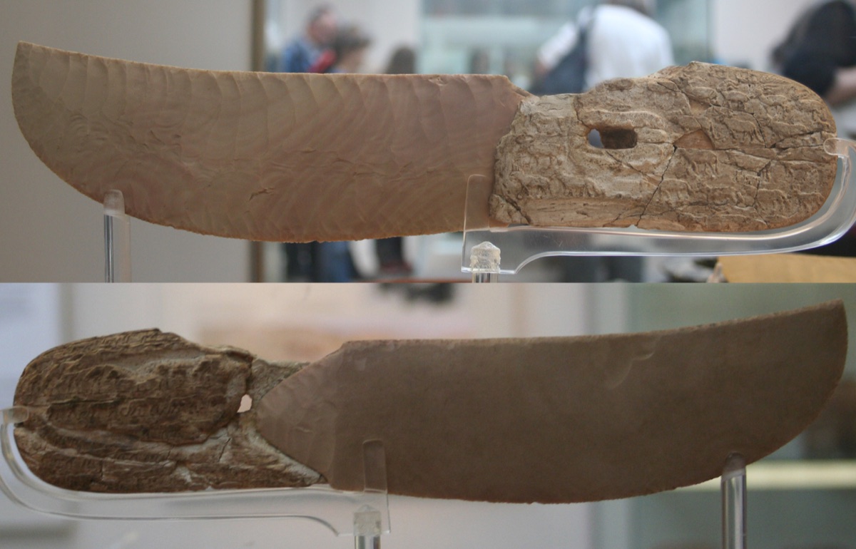 Both sides of the Pitt-Rivers Knife, showing its flint blade and carved ivory handle.